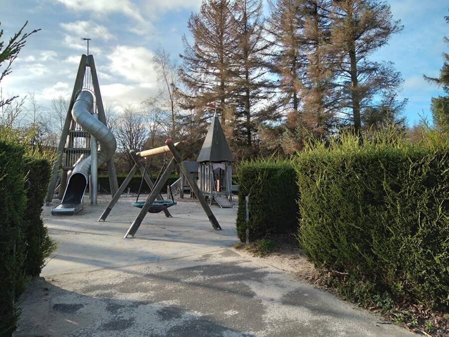 Craigtoun park play area including a large tunnel slide amongst other park equipment