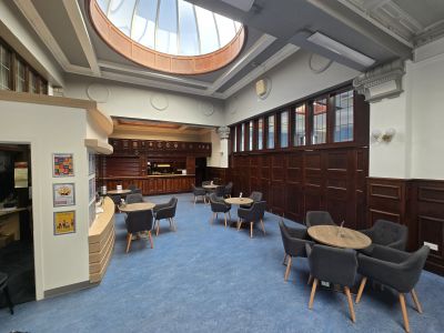 bright and airy lounge showing seating arrangement and bar area